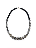 lapisatelier.com beaded statement necklace with black beads and spotted Dalmatian jasper featuring gold-toned accents
